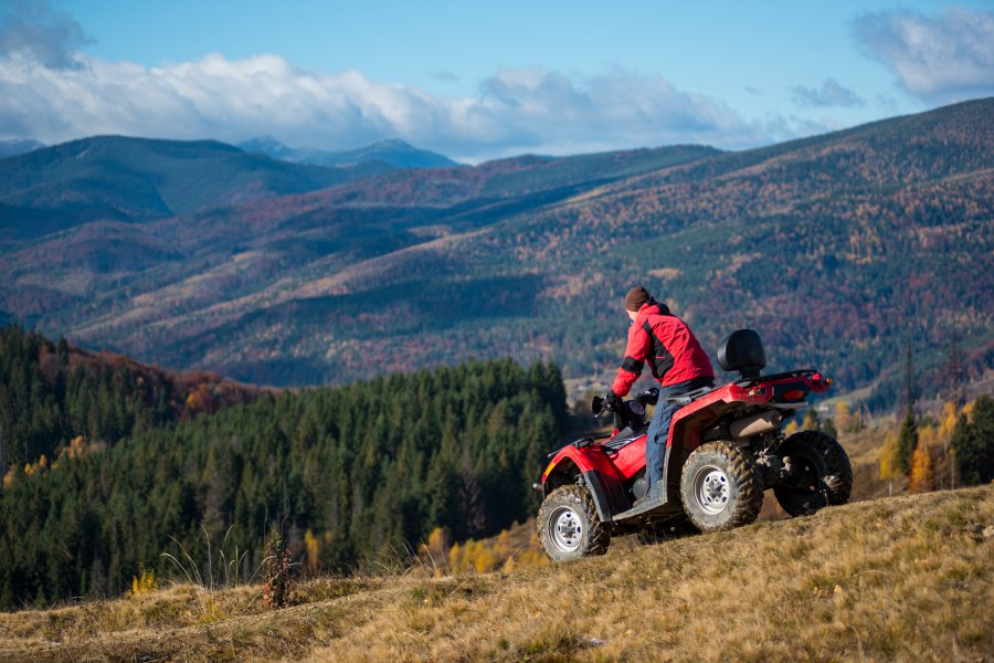 Man in an ATV in the mountains