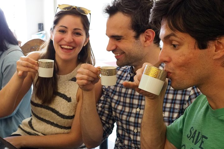 two men and a woman enjoying food tasting