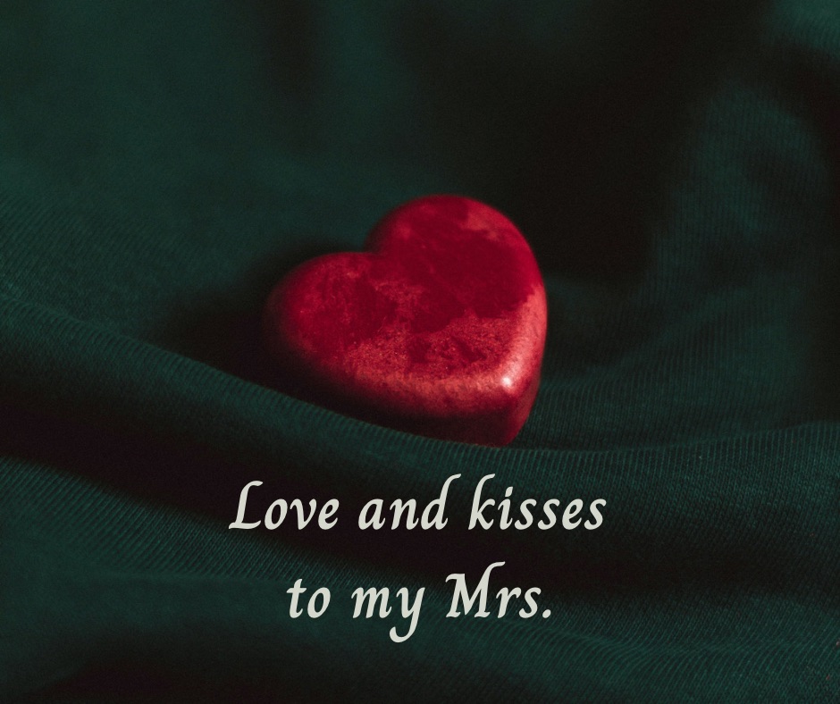 a red heart on emerald background wit ha caption above the heart saying Love And Kisses To My Mrs