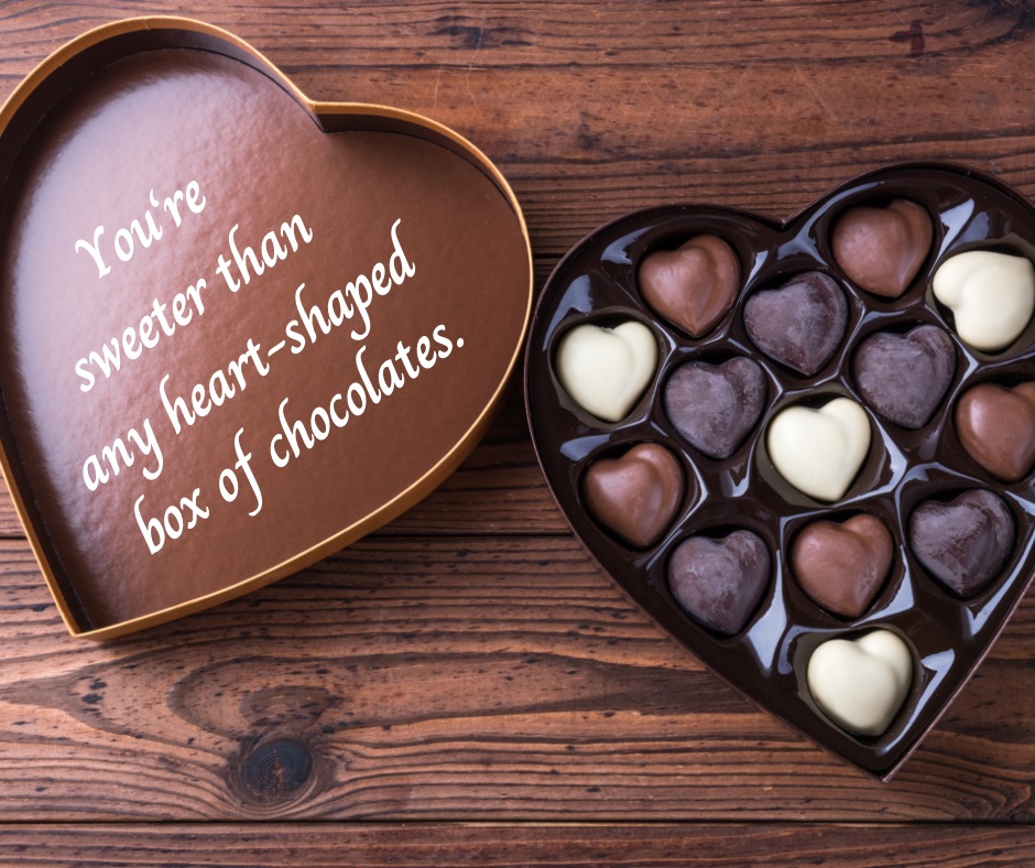 an opened heart-shaped box of chocolate with message on the inside part of the box saying You're sweeter than any heart-shaped box of chocolates